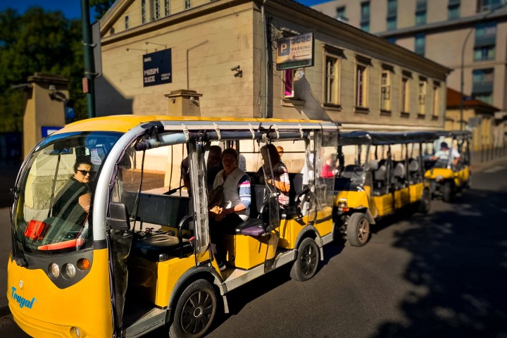 a group of people riding on the back of a truck
