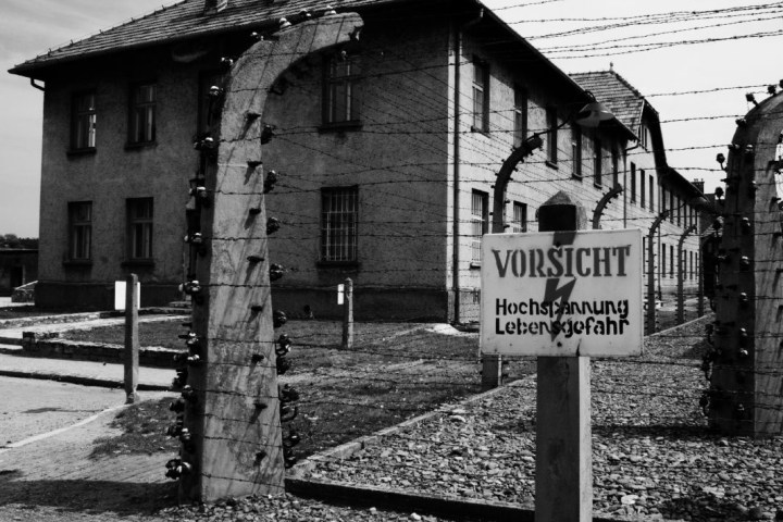 a house that has a sign on the side of a building