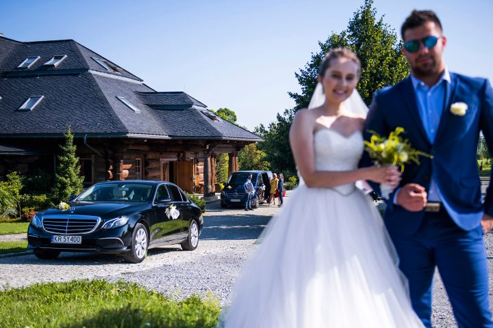 a man standing in front of a car posing for the camera
