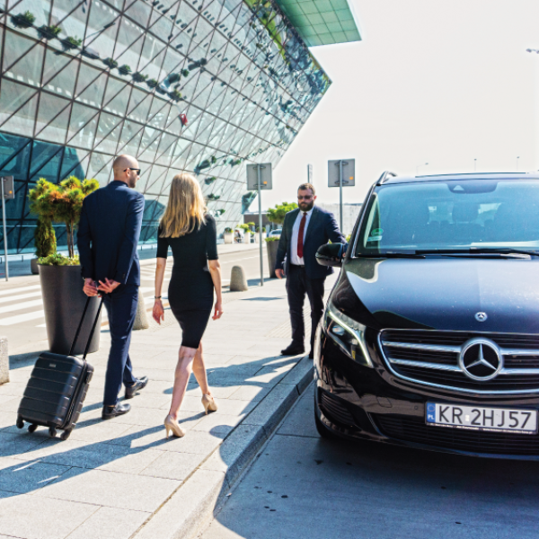a person standing next to a car
