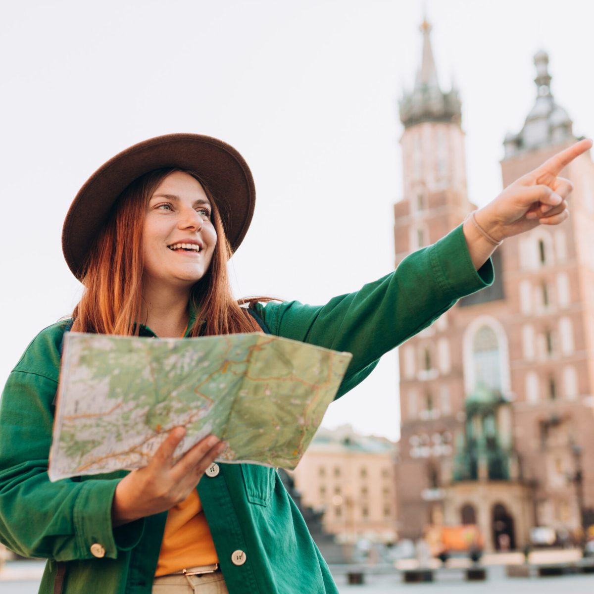 a person in a green shirt doing a trick