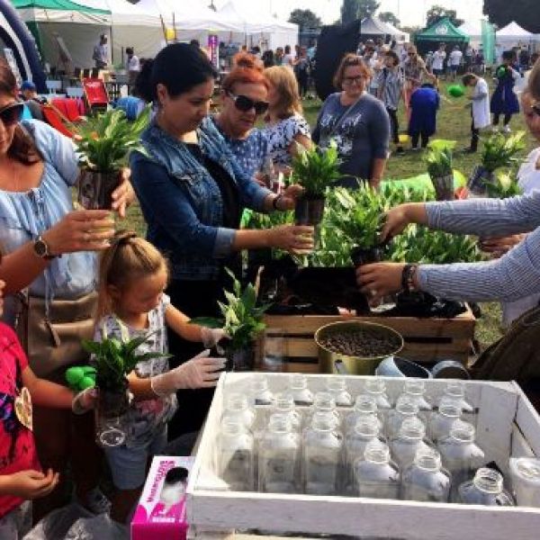 a group of people standing next to a child