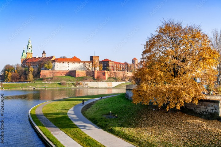 a castle on top of a grass covered field